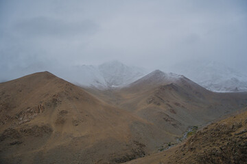 rolling hills and clouds on the top of the mountain at Ladakh, Leh, India