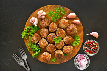 Fried meatballs on cutting board