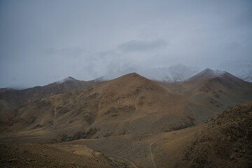 rolling hills and clouds on the top of the mountain at Ladakh, Leh, India