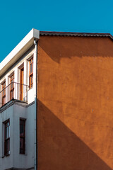 The orange firewall is on the background of the blue sky.