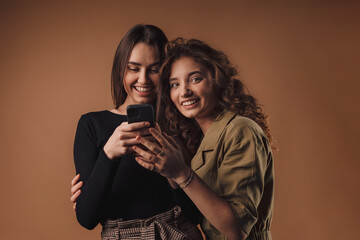 Portrait of two young happy girls, studio shoot,