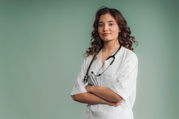 Portrait of young curly nurse, studio shoot.