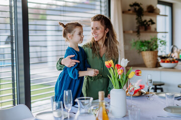 Little girl with her mother celebrating spring.