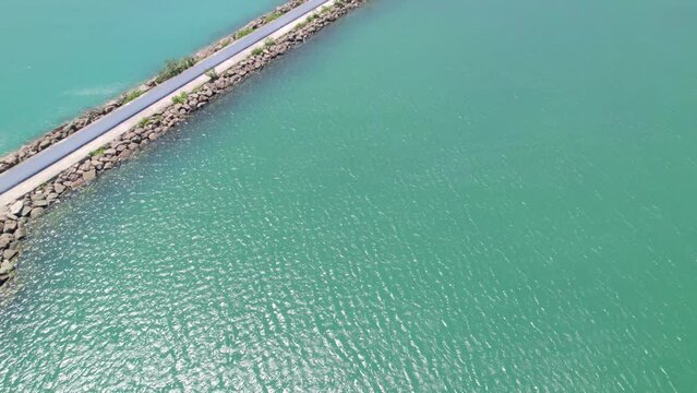 aerial view of the sea and the coast. Aerial view of Gerze harbor on a sunny summer day. Lighthouses and small harbors. Black Sea coast. Aerial shot of a small seaside town.