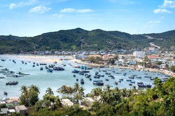 Fototapeta na wymiar The beautiful panoramic landscape of Vietnam beach, Vinh Hy bay, Ninh Thuan, with group of boats are anchoring at fishing village