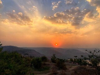 Beautiful view of the sunset and mountains from Sajjangad, satara, Maharashtra, India.