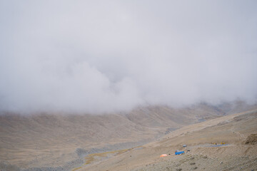 rolling hills and clouds on the top of the mountain at Ladakh, Leh, India
