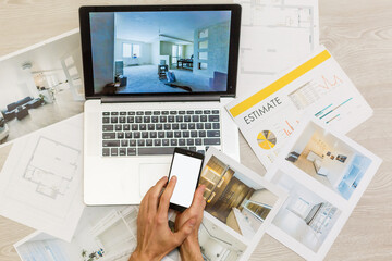 top view of Designer hand working with laptop computer on wooden desk as responsive web design...