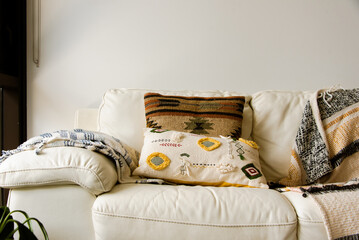 Homey living room in Sydney Apartment, couch, patterned pillowcase, sun-drenched morning, interior