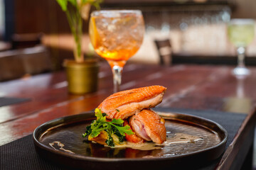 grilled chicken with vegetables and glass of orange Cocktail