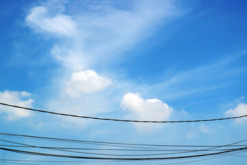 Blue Sky with White Clouds and Dangling Wires