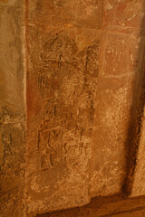 Ancient Egyptian hieroglyphs carved on Giza stone wall