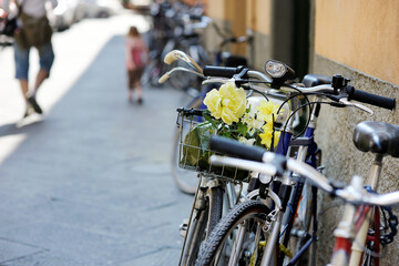 Fototapeta na wymiar Bicycles parked on beautiful medieval streets of Lucca city, Tuscany, Italy.