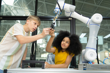 Children using the hand robot technology, Students are studying technology, which is one of the...