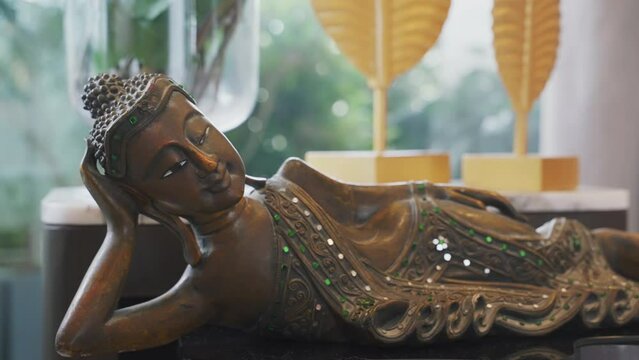 Carved Reclining Buddha Statue - Serene Buddhist Figure Lying In Peace, Masterpiece Of Exquisite Craftsmanship. closeup