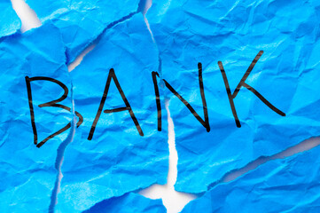 Crumpled paper with word Bank. Failure and collapse of a bank and economic and financial market...