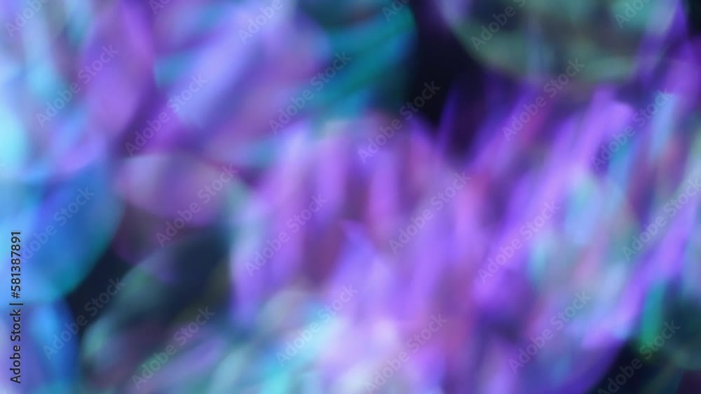 Wall mural abstract background of electric bokeh in motion. smooth movement of blue and purple bokeh circles wi