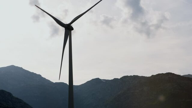 Scenic view of wind turbines on a mountain pass. Windmill in scenic settings, sustainability in nature