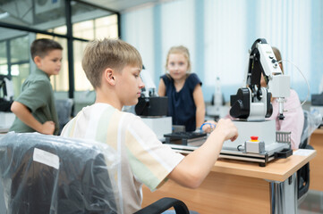 Children using the hand robot technology, Students are studying technology, which is one of the STEM courses.