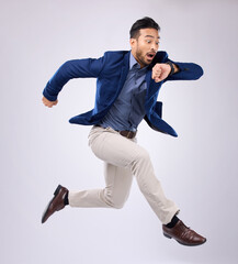 Wristwatch, jump and Asian man late, appointment and employee against a grey studio background....