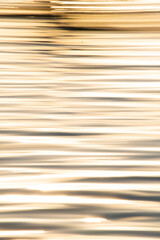 Abstract photo of water and sunrise, liquid gold