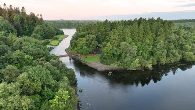 summer drone shot of footbridge in killykeen forest park, cavan, ireland