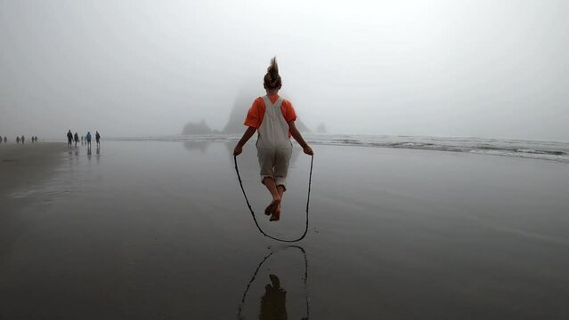 Girls Jump rope on the beach in Oregon
