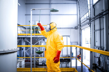 Safety at work. Occupational health and safety regulations. Worker in chemicals production plant...