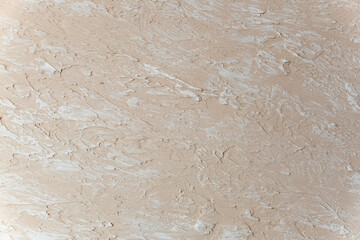 Decorative Beige putty sample on the wall. decorative plaster concrete textured background. Textured