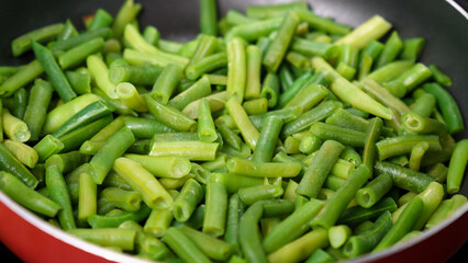 Green beans ready for cooking in frying pan. Bio green beans. Cooking concept