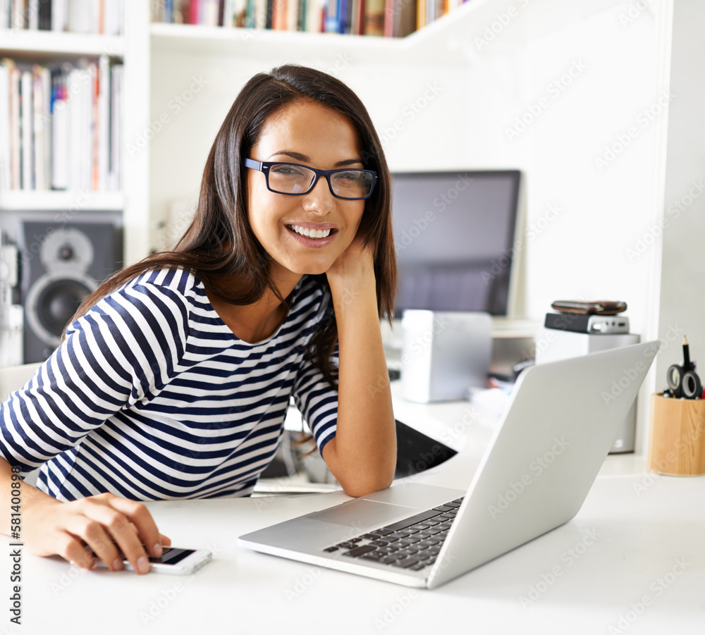 Canvas Prints Immersed in the tech world. Portrait of an attractive young woman surfing the net from her home study.