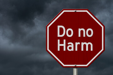 Do no harm message on red street stop sign