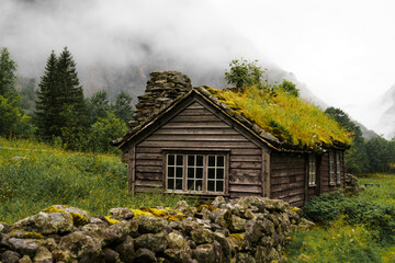 Classic Scandinavian hut with grass roof in Norway
