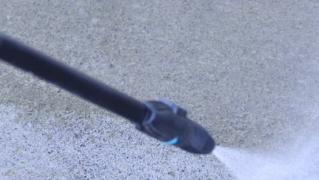 pressure washer cleaning concrete