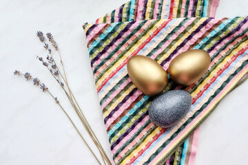 Easter painted eggs on a multi-colored napkin