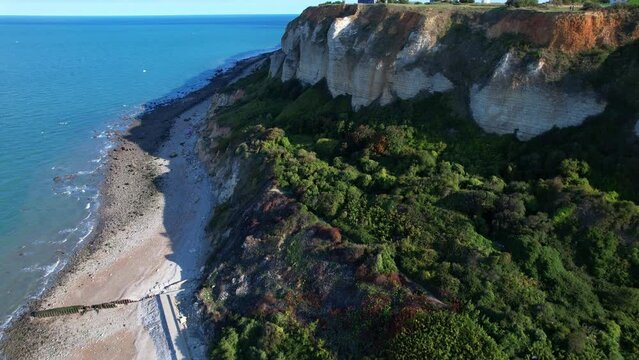 Tilt-up Reveal Of Lighthouse And Historical Landmark Phare de la Heve On High Limestone Plateau Of Cap de la Heve, France. aerial