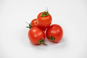 red tomatoes on a white background