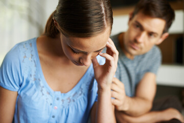 Naklejka premium It cant go on like this. a young couple having a disagreement at home.