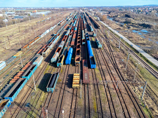 Aerial view landscape. View of railroad tracks and trains, wagon, cargo.