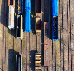 Aerial view landscape. View of railroad tracks and trains, wagon, cargo.
