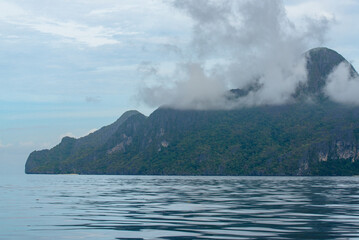 Rocky landscape with sea , mountains and trees