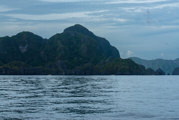 Rocky landscape with sea , mountains and trees