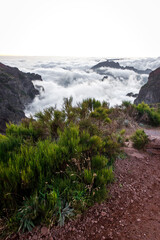 Twilight in the mountains. Beautiful valley with mountain peaks and clouds.