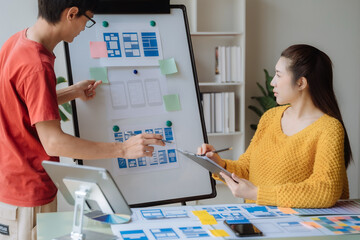Creative digital development agency. developer team brainstorming on their project with laptop,...