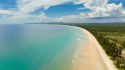 Seascape with tropical sandy beach and blue ocean. Borneo, Malaysia. Tindakon Dazang Beach.