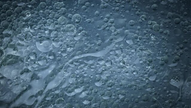 Super Slow Motion Shot of Oil Bubbles in Water at 1000fps.
