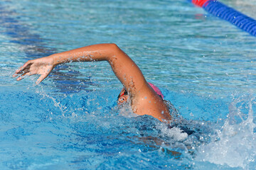 Sport man swimming in the pool at the sport complex.Professional Athlete Training for the Championship.Male Swimmer swimming in swimming pool.