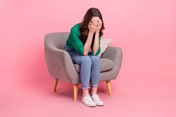 Full length photo of crying tired woman wear green shirt sitting couch arms close eyes isolated pink color background - obrazy, fototapety, plakaty
