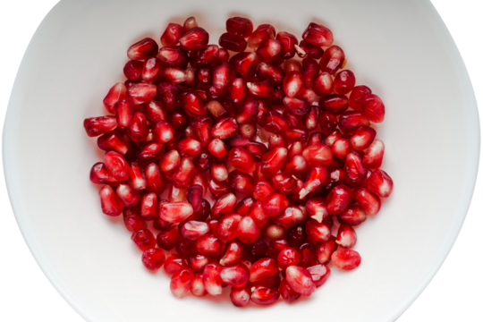 pomegranate seeds in a plate close-up top view on a transparent background