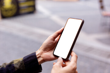 cell phone blank white screen mockup.hand holding texting using mobile on desk at office.background empty space for advertise.work people contact marketing business,technology